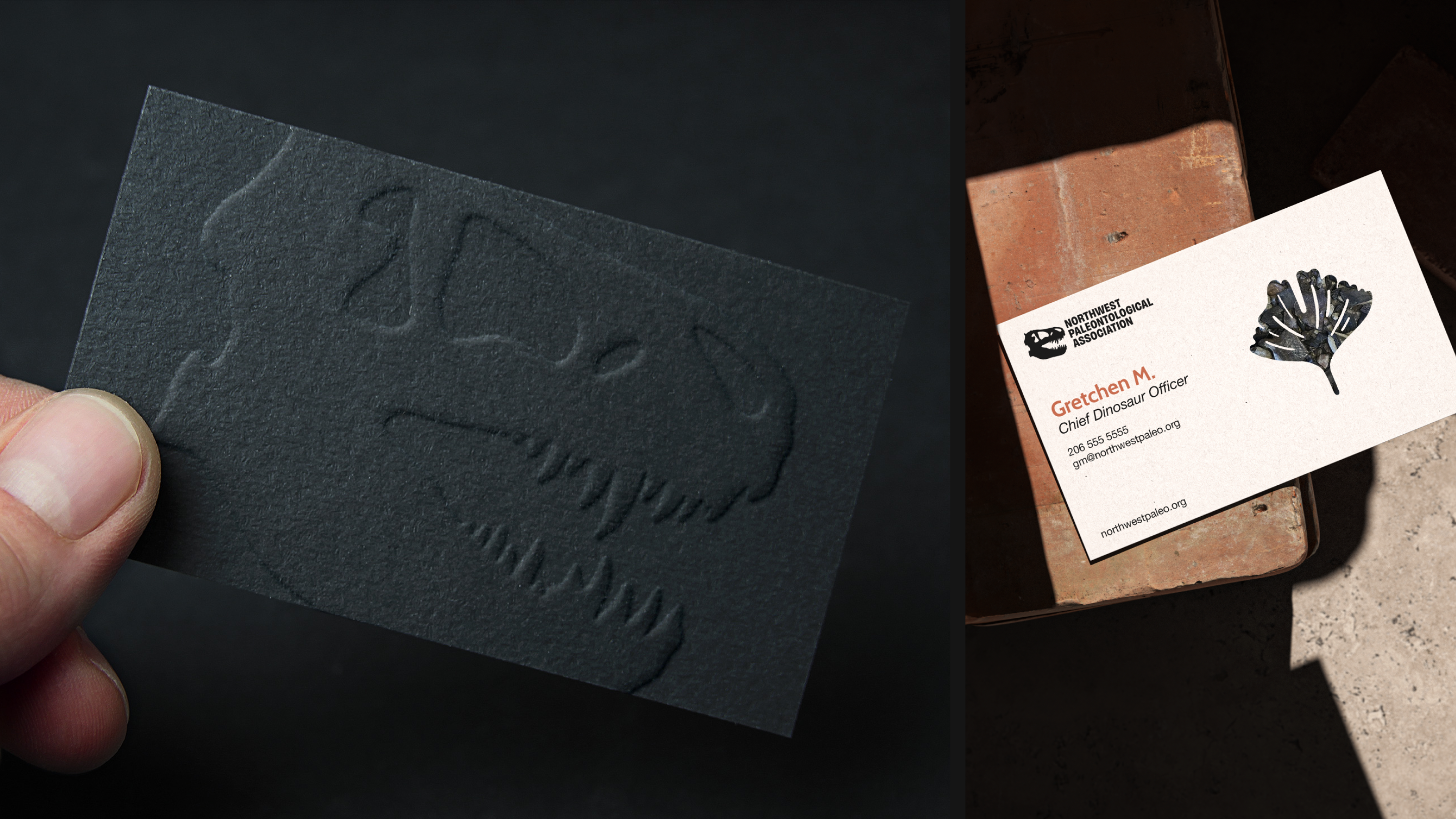 A black dinosaur skull embossed business card