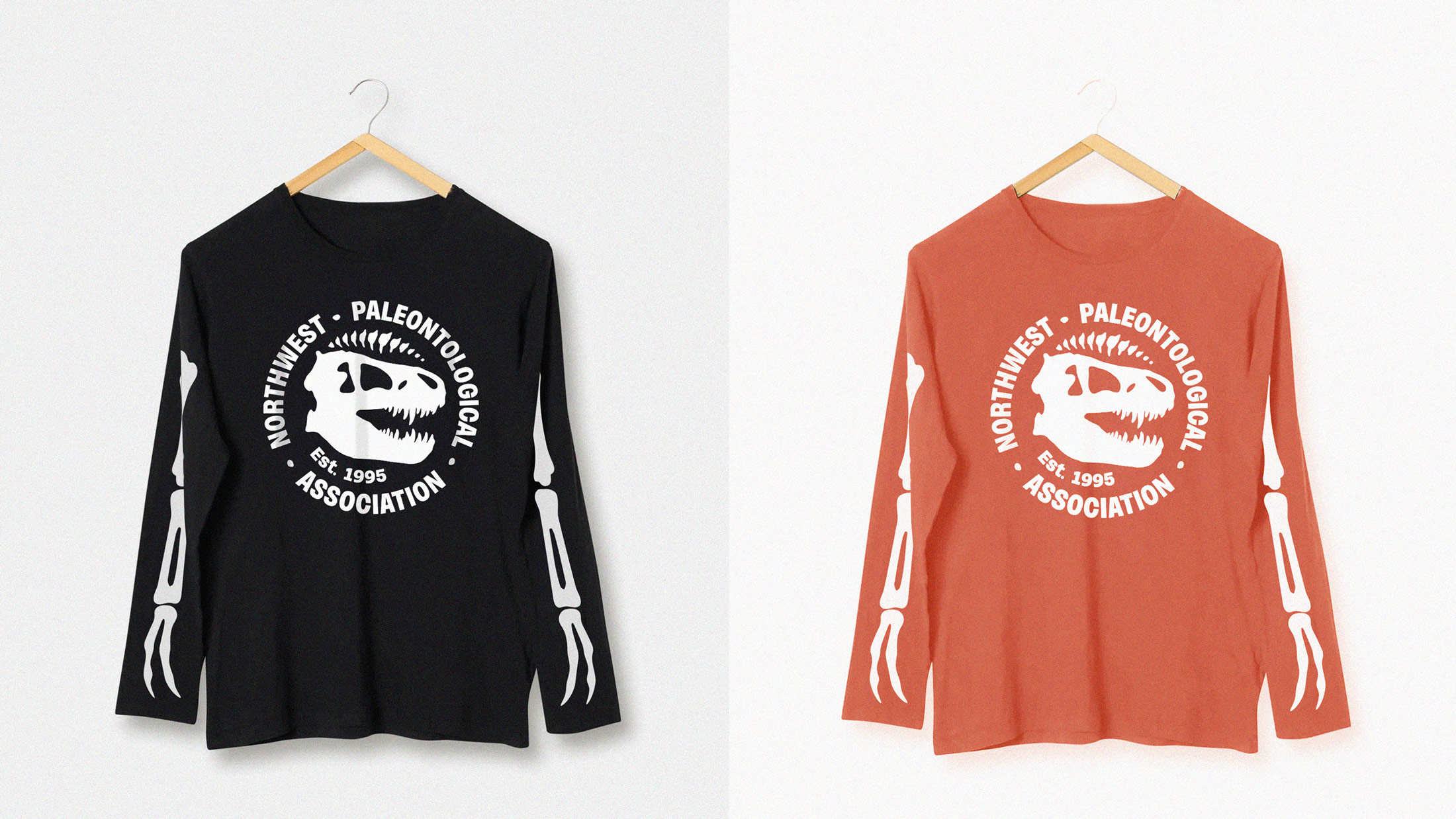 The NPA logo on two long sleeve shirts in orange and black, respectively, with bones on the arms