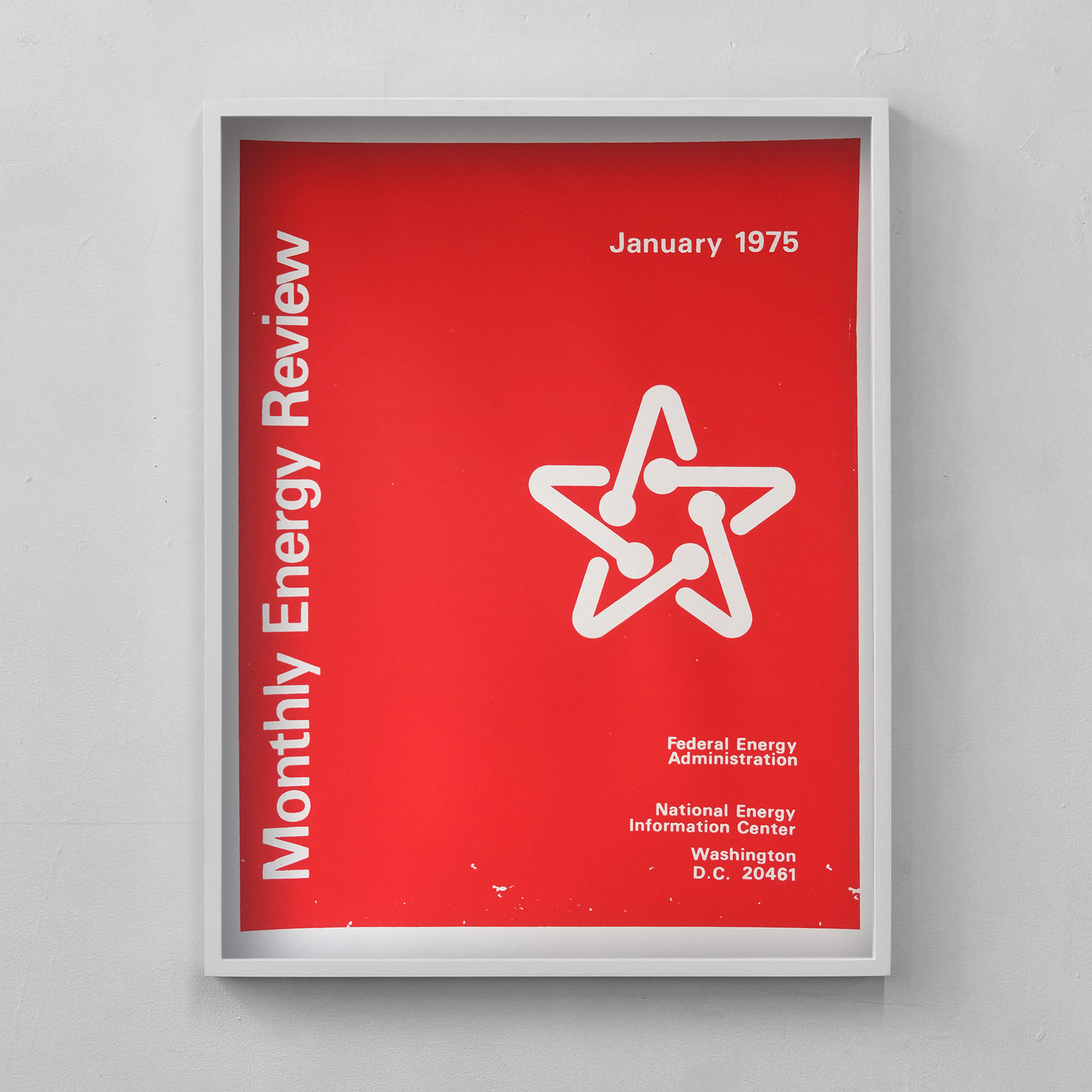 a red ink on cream paper poster of the Monthly Energy Review cover from January 1975