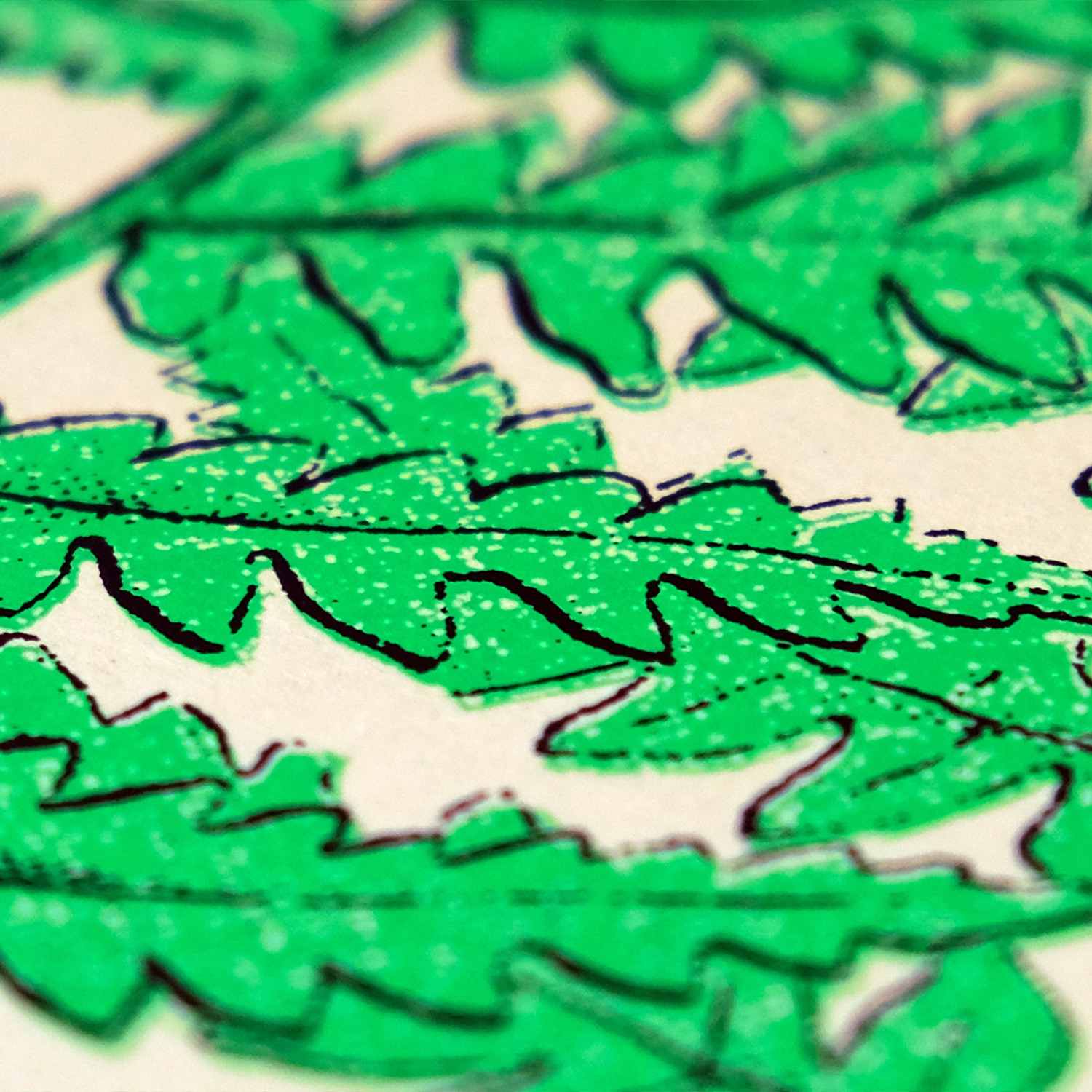 Close up shot of a bright green silkscreen print of a fern