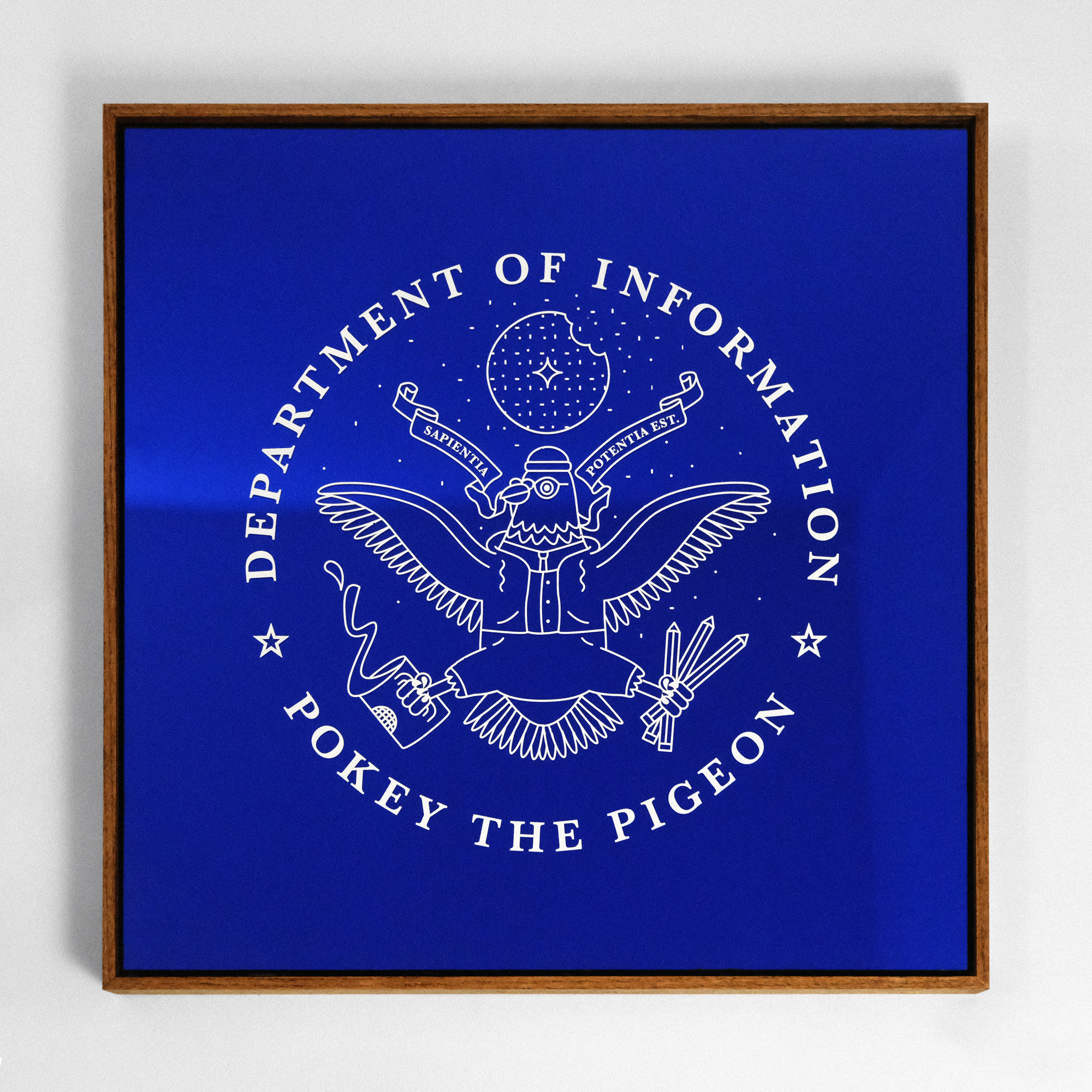 A blue reflective mirror with a Pokey the Pigeon seal silkscreened on it in white ink